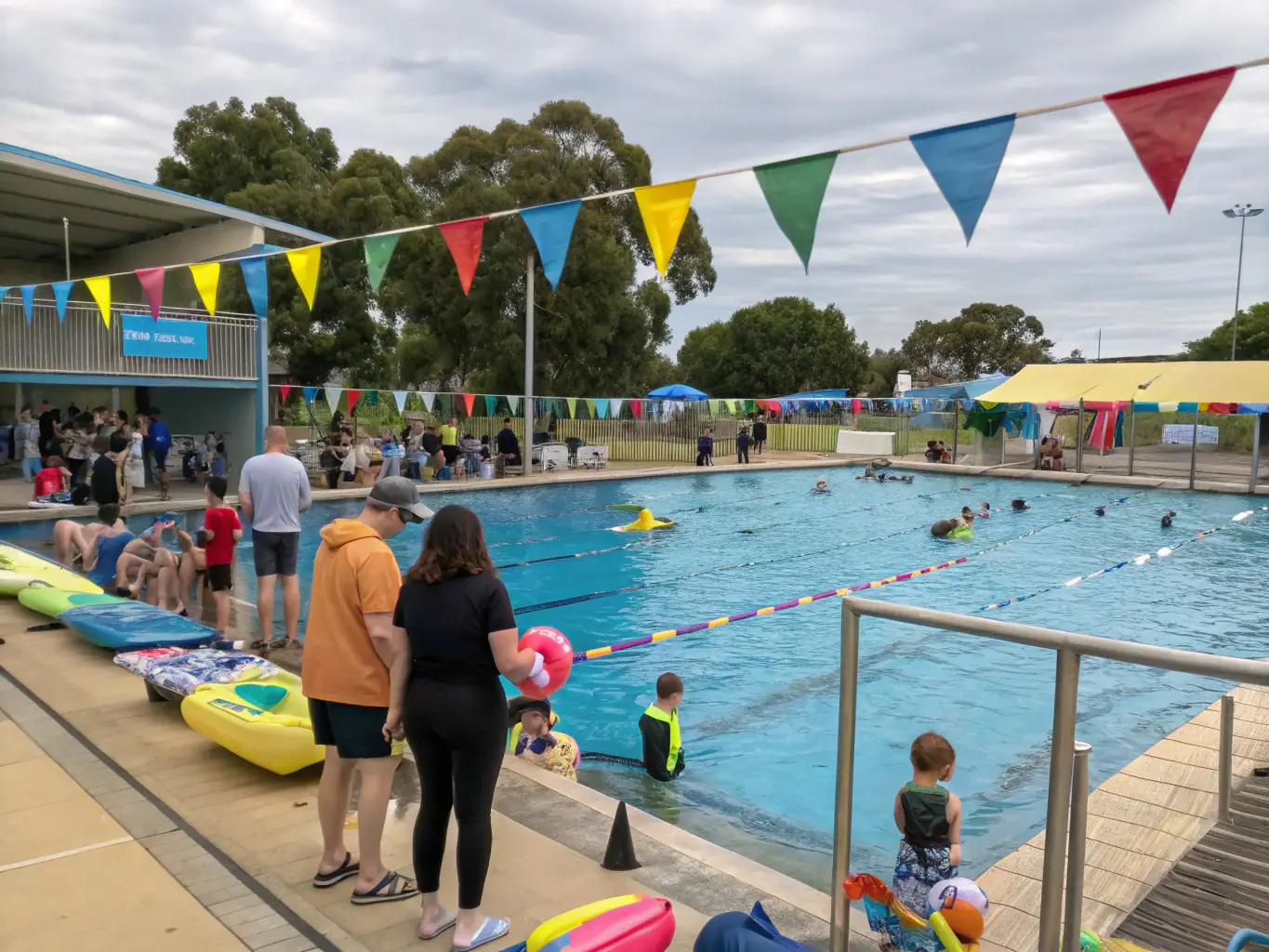A group of diverse individuals participating in a community swimming event, showcasing the inclusive and community-focused environment of LES DAUPHINS PONTILABIENS.